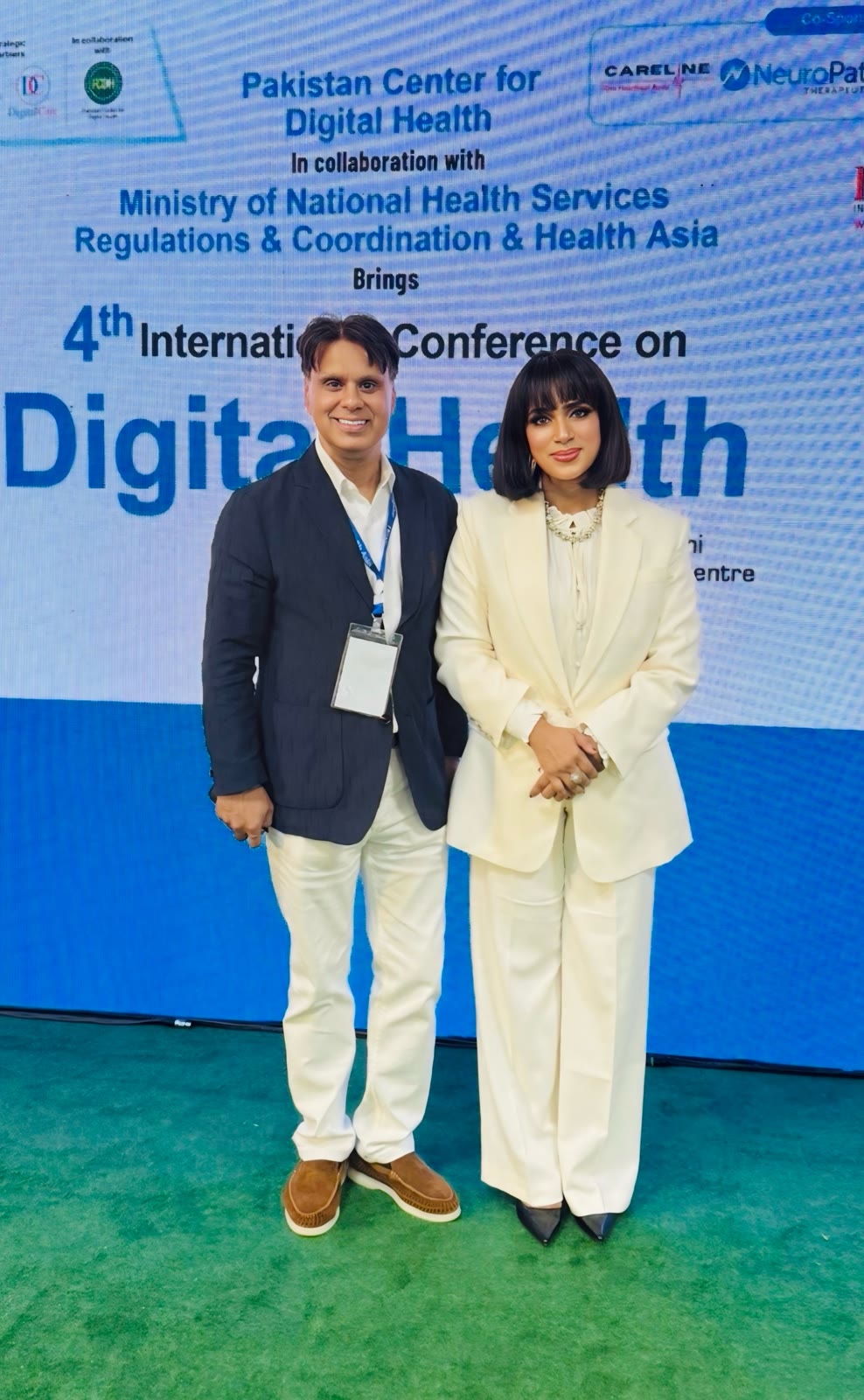 Tanha Tabassum with a delegate at the Health Asia photo wall